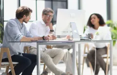 Office employees having conversation