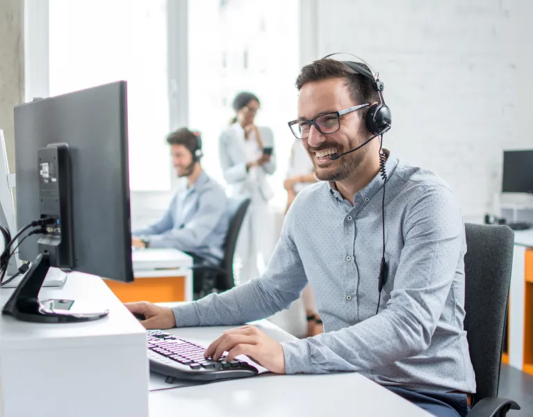 Man on phone in busy office